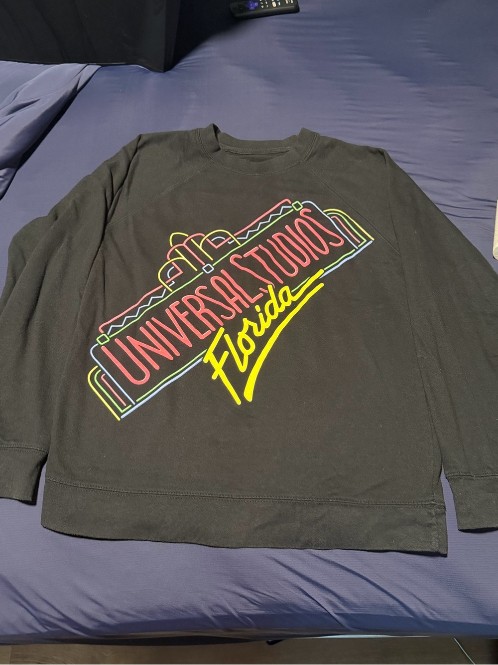Universal Black Crewneck Sweatshirt with Neon Multi-Color Logo